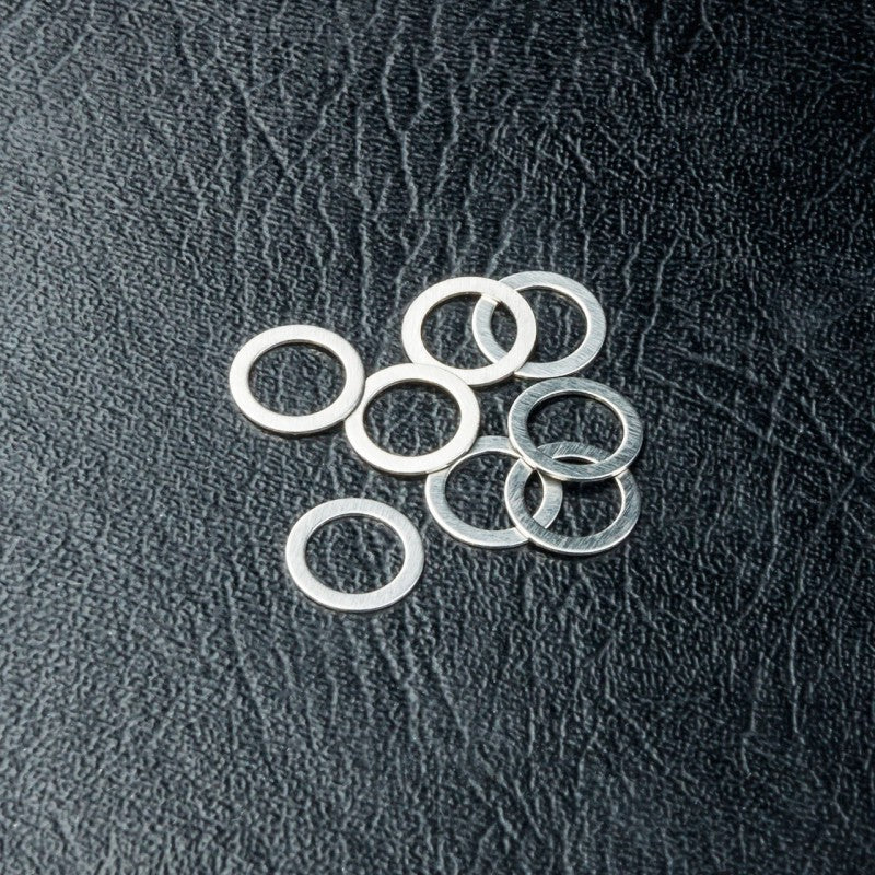 DISC.. Spacer 5X7X0.3 (8)